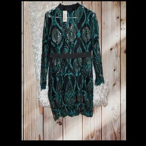 Beautiful peacock sequence dress . Sheer in neck/breast.